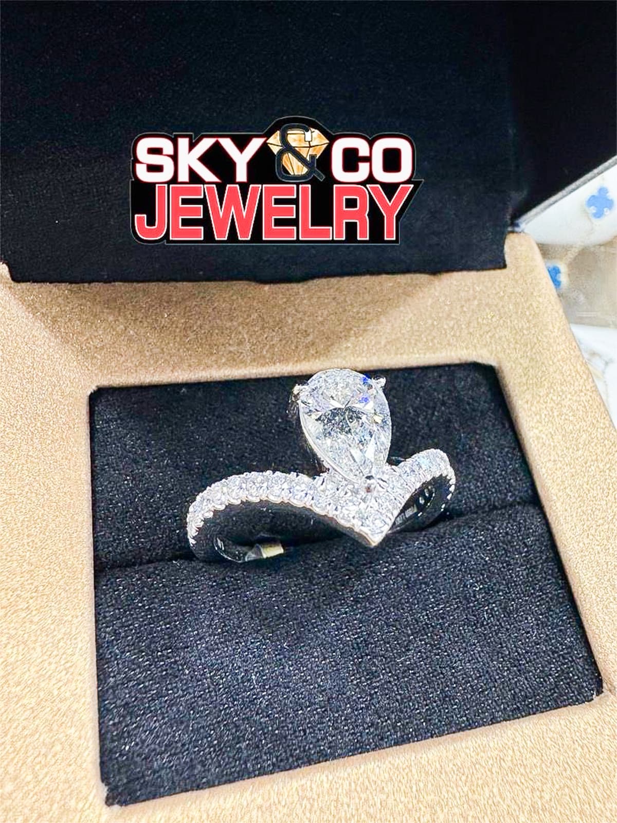 Elegant diamond snake-shaped ring in Sky & Co Jewelry presentation box