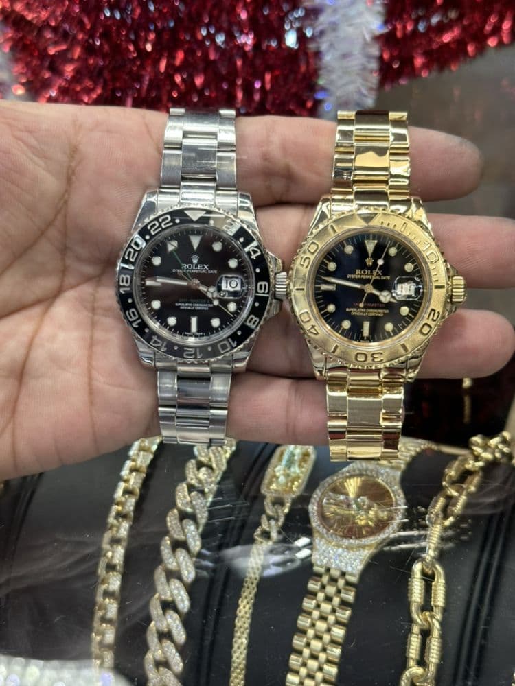 A Rolex GMT-Master II and a gold Rolex Yacht-Master