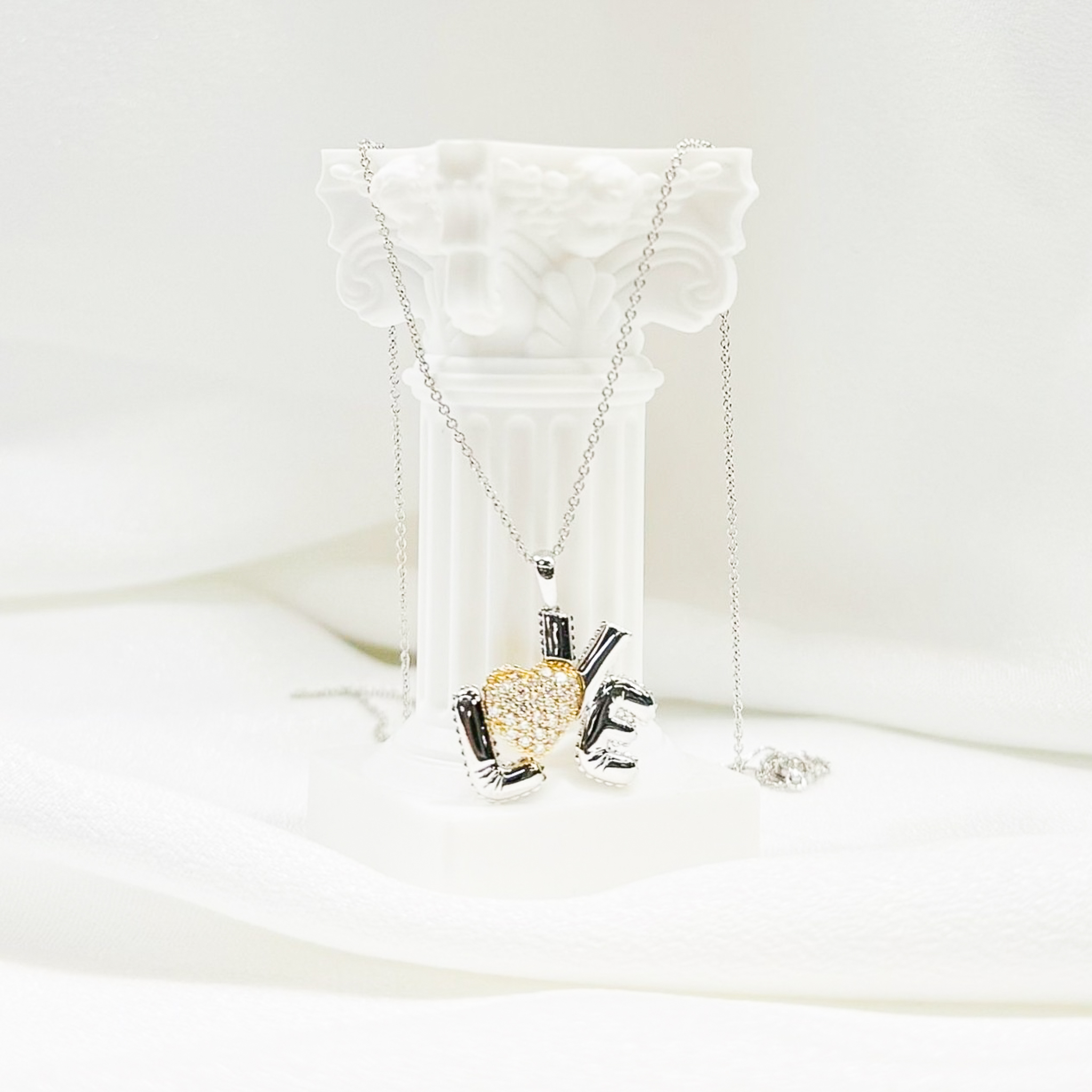 Elegant 'LOVE' pendant necklace with mixed metal design