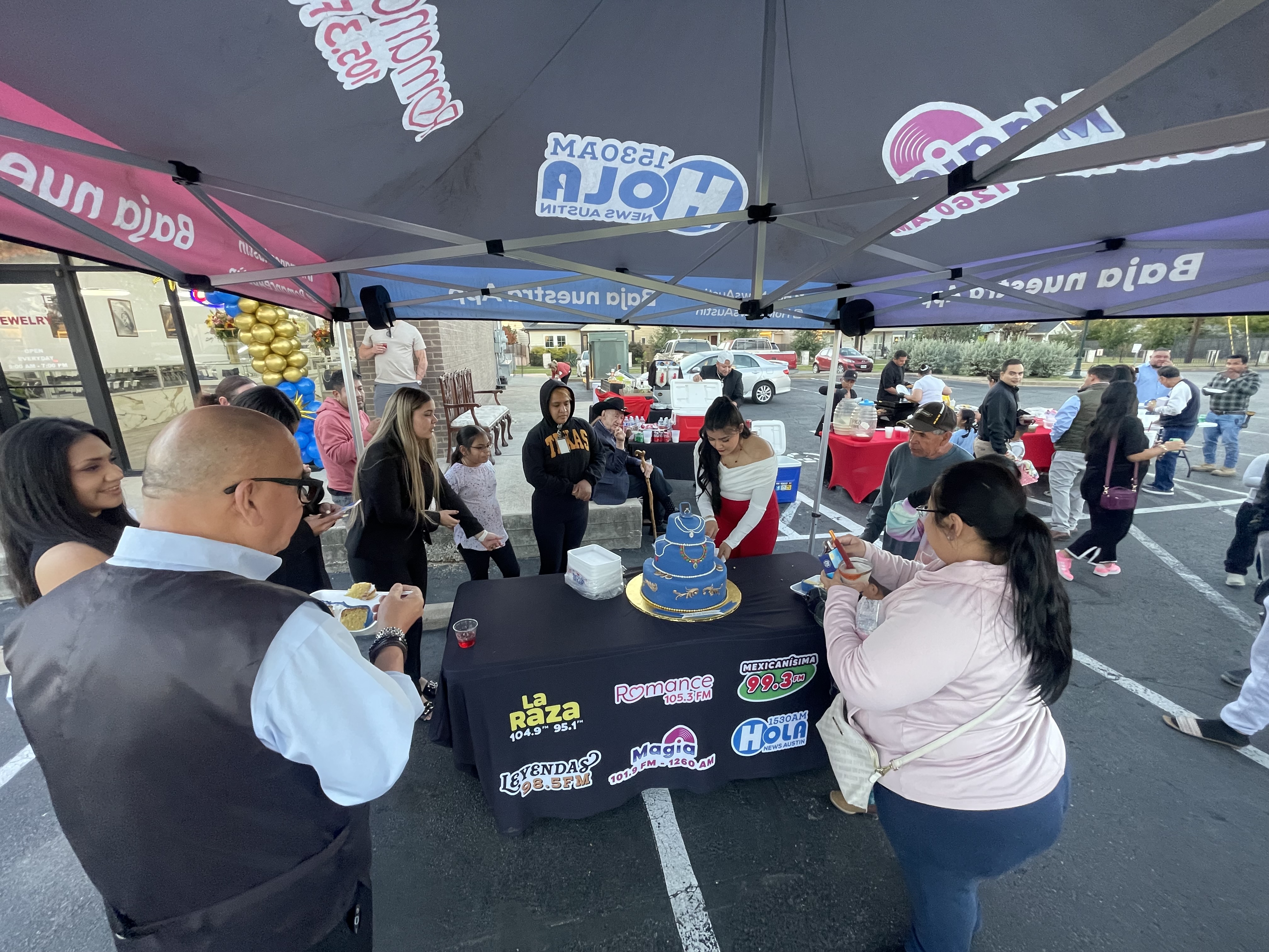 Outdoor celebration at grand opening event